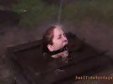 A cute redhead slave tortured outside