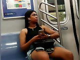 Beautiful black Asian dark thick legs in shorts on the train